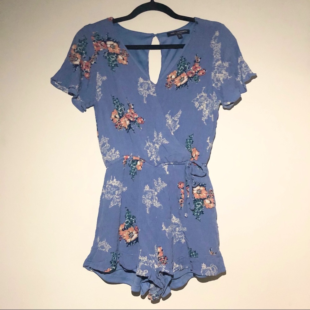 Blue surplice romper with floral print